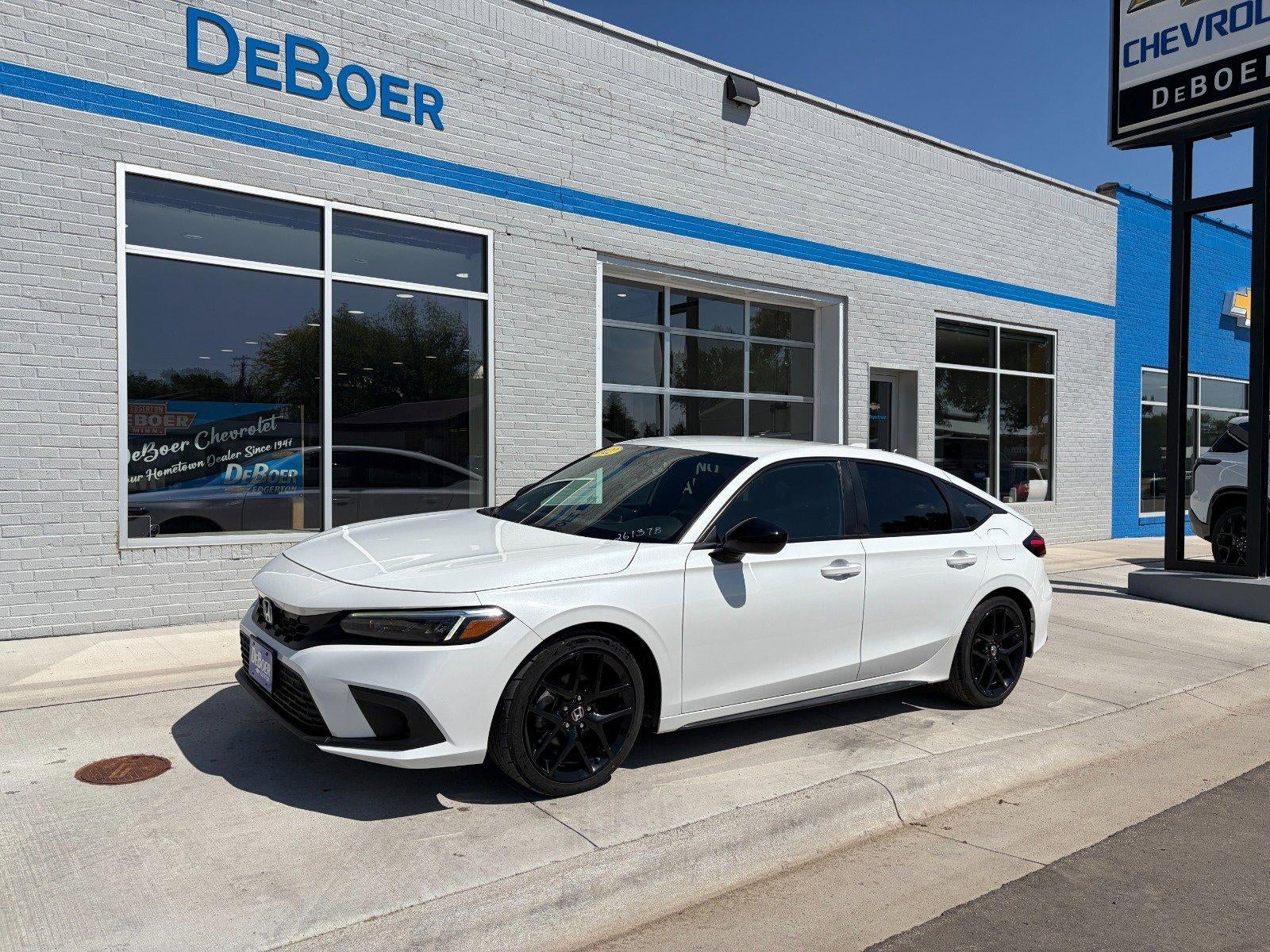2022 Honda Civic Hatchback Sport in White — front three-quarter view